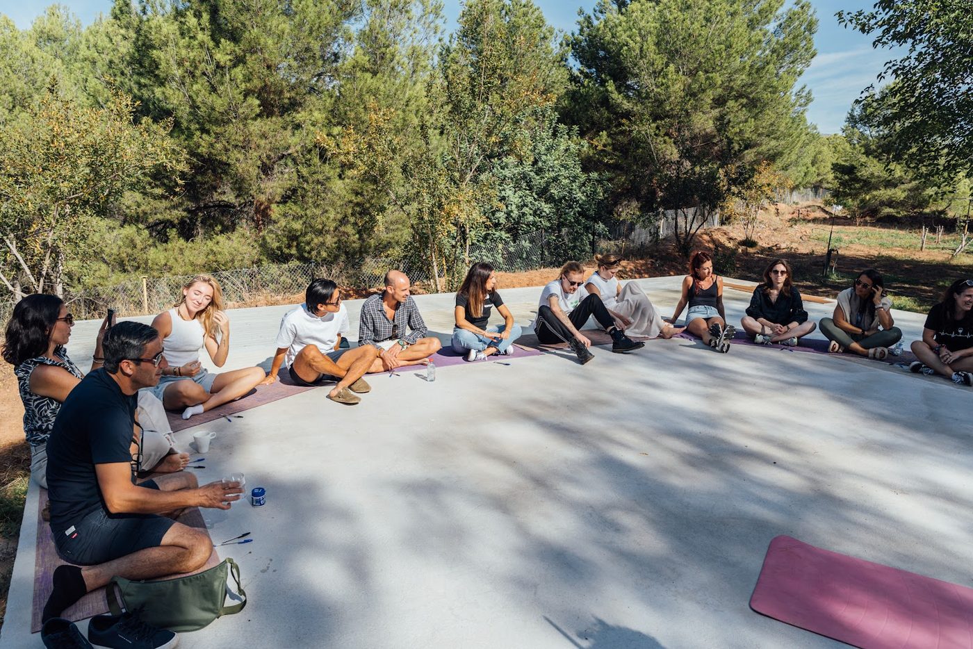 A wide circle of members meeting outdoors