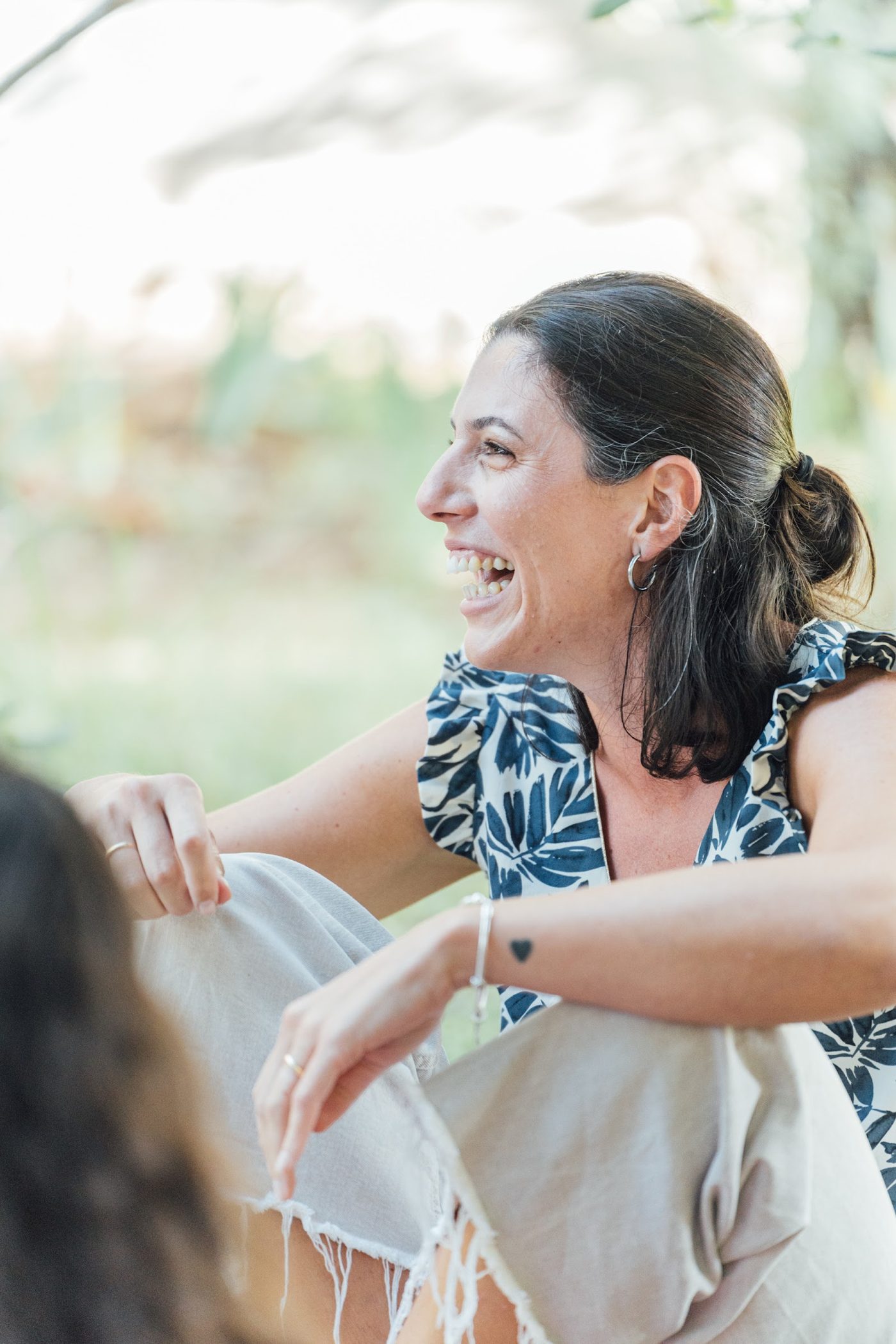 A member laughing at a YOUNG gathering