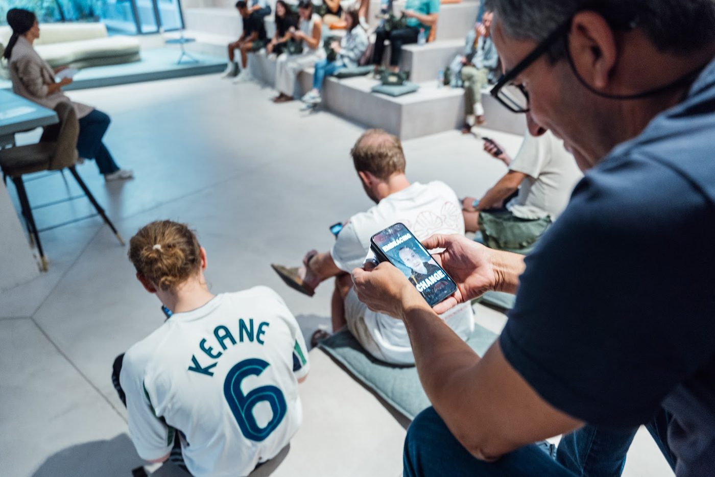 Filming on a phone at a YOUNG event