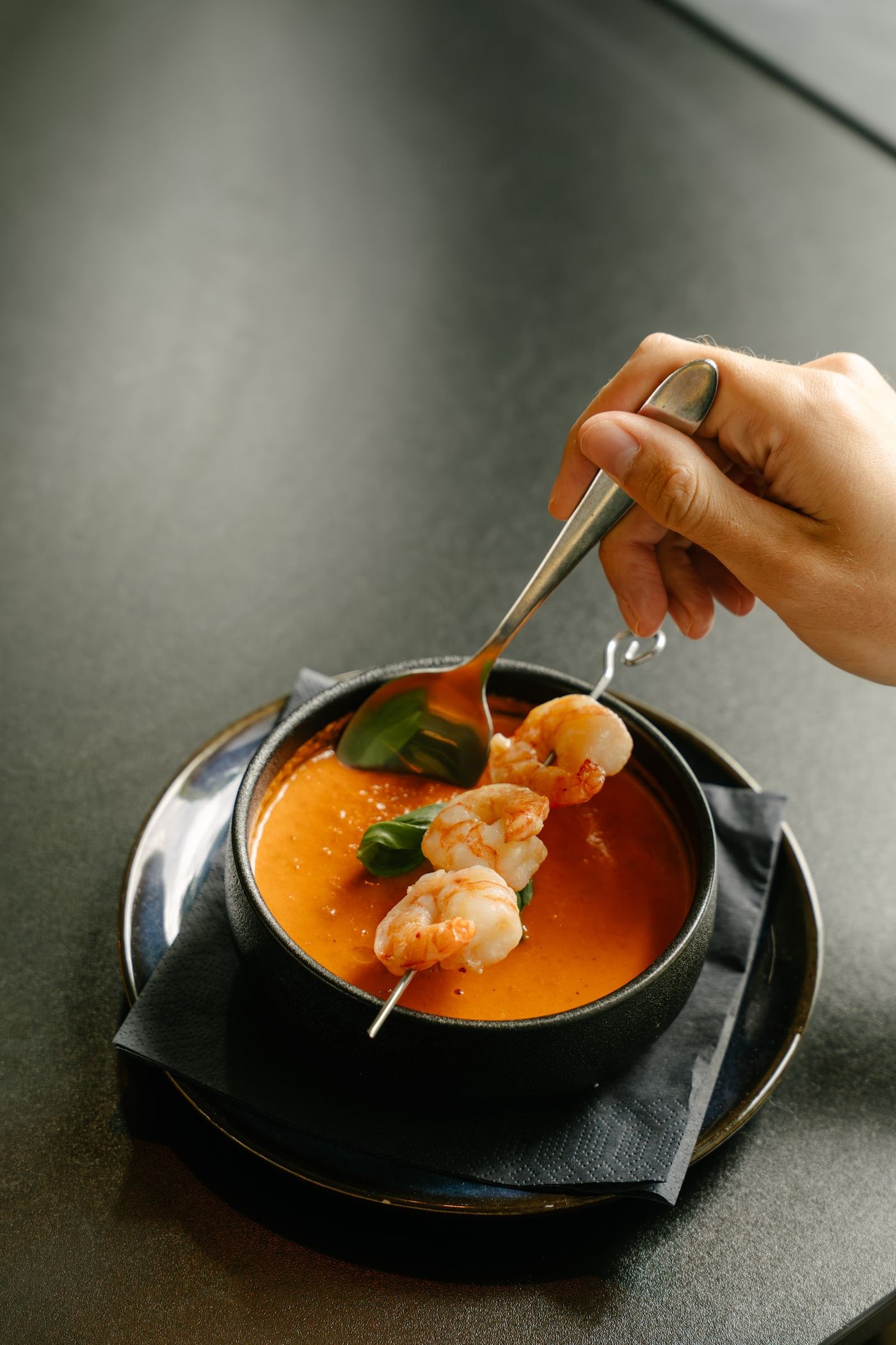 Soup served in a black bowl