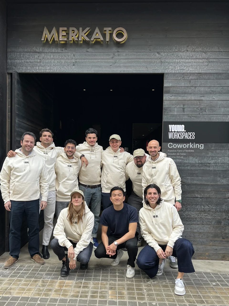 The YOUNG team outside the YOUNG.Workspaces coworking entrance